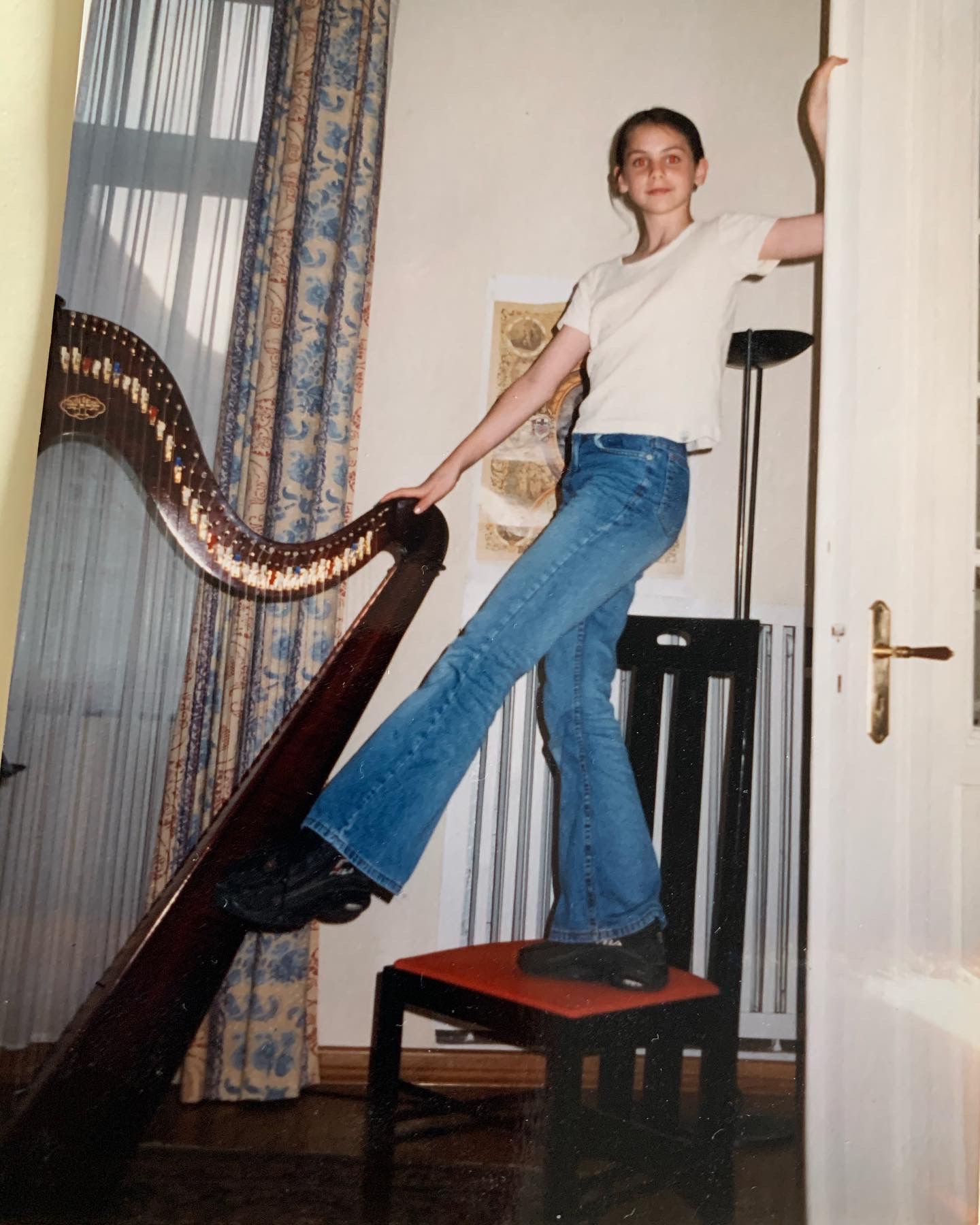 Young Esther posing with her harp.